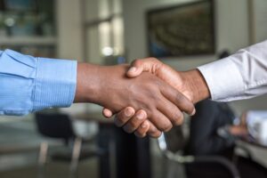 handshake. Who your podcast associates with could strengthen or damage your reputation 